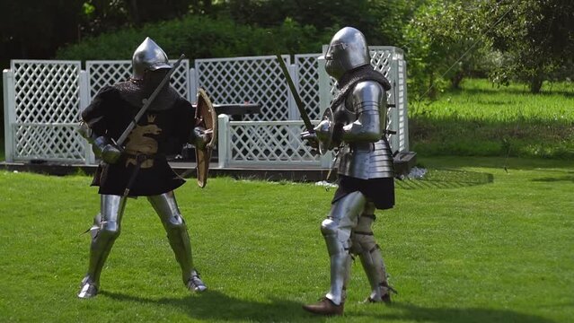 Historical Battle: Armored Medieval Knights Fighting with Swords.