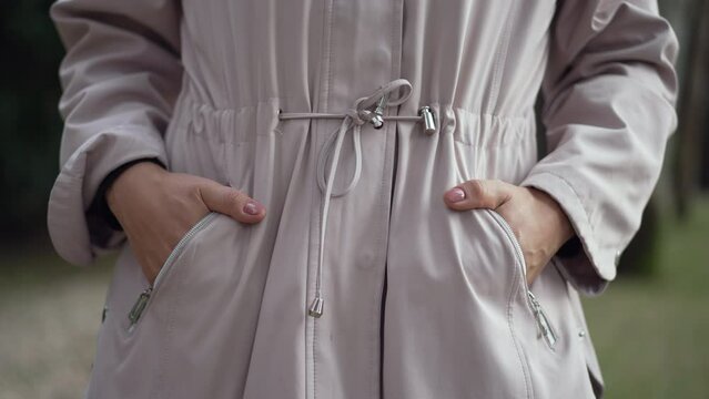 Woman With Hands In Coat Pocket Inside Jacket Closeup Hand