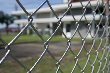 The fence is made of metal wire.