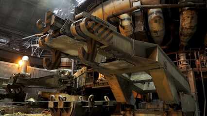 Close up for big hooks of the metallurgical chute at the factory, heavy industry concept....