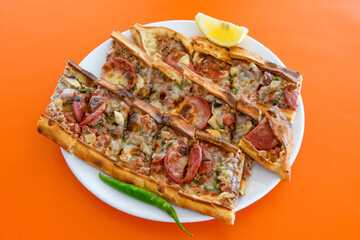 Turkish pita with minced cubed meat and cheese (Turkish name: Kiyma Kusbasi kasarli pide)