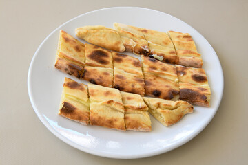 Turkish pita with minced cubed meat and cheese (Turkish name: Kiyma Kusbasi kasarli pide)