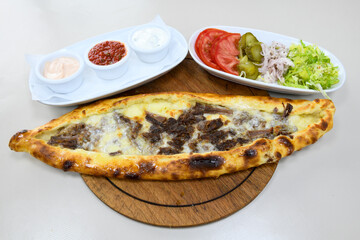 Turkish pita with minced cubed meat and cheese (Turkish name: Kiyma Kusbasi kasarli pide)