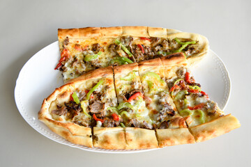 Turkish pita with minced cubed meat and cheese (Turkish name: Kiyma Kusbasi kasarli pide)