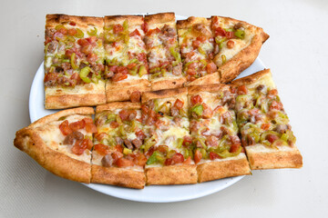 Turkish pita with minced cubed meat and cheese (Turkish name: Kiyma Kusbasi kasarli pide)