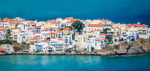 Fototapeta na wymiar andros island capital called andros houses lighthouse sea greece