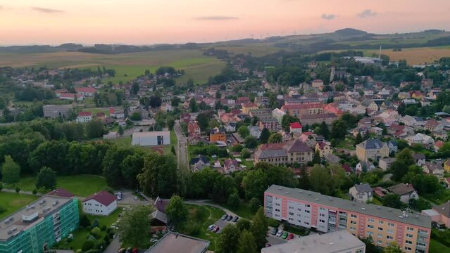 Drone Hyperlapse above small town in Northern Czech Republic during sunset