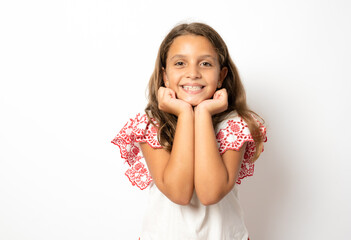 Close up portrait of cute smiling kid girl standing isolated over white background.
