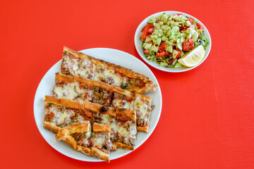 Turkish pita with minced cubed meat and cheese (Turkish name: Kiyma Kusbasi kasarli pide)