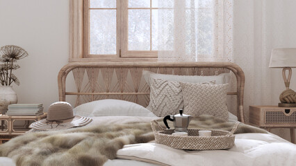 Country bed close up. Boho chic bedroom with rattan furniture, fur blanket, pillows, duvet and decors in white and bleached wood tones. Farmhouse interior design