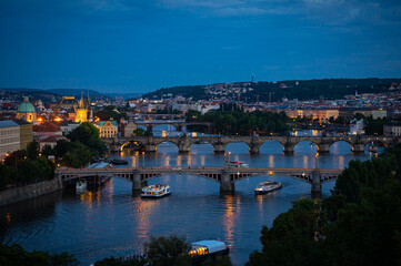 Fototapeta na wymiar Famous bridges over river Vltava in the old town of Prague after sunset, during blue hour