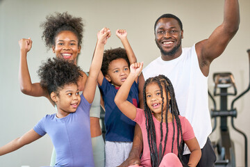 Group of diverse family of african american in sport club for workout concept