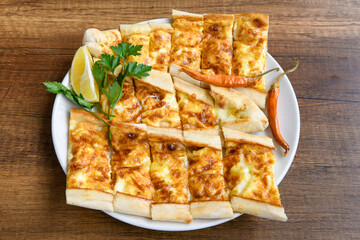 Turkish pita with minced cubed meat and cheese (Turkish name: Kiyma Kusbasi kasarli pide)