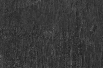 Old cracked messy black paint grunge texture. Dark distressed background