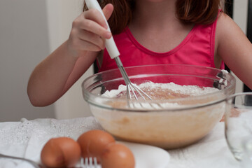 child baking cookies