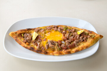 Turkish pita with minced cubed meat and cheese (Turkish name: Kiyma Kusbasi kasarli pide)