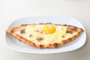Turkish pita with minced cubed meat and cheese (Turkish name: Kiyma Kusbasi kasarli pide)