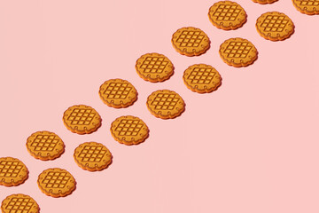 Traditional, old fashioned cookies, cute pattern with creative copy space on pastel pink background.  
