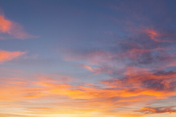 Naklejka na ściany i meble Amazing sunset with pink clouds and blue sky