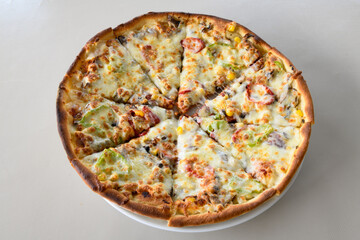 Delicious mixed pizza with rich content. Menu concept of choice and diversity