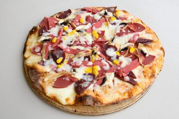 Delicious mixed pizza with rich content. Menu concept of choice and diversity