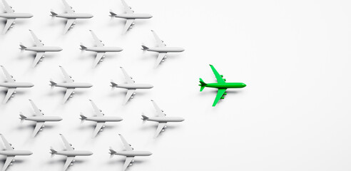 Fototapeta premium Group of white airplanes with green leader on white background - green energy travel concept - 3D illustration