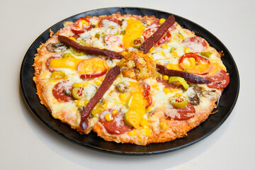 Delicious mixed pizza with rich content. Menu concept of choice and diversity