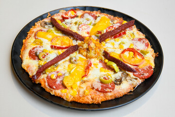 Delicious mixed pizza with rich content. Menu concept of choice and diversity