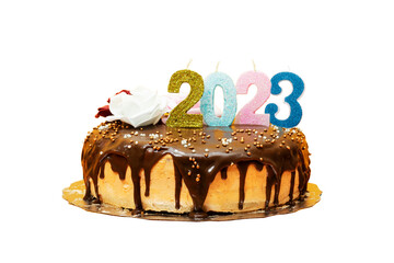 2023 new year birthday cake chocolate and cream decorated with numbers candle and flowers isolated on white