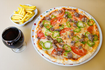 Delicious mixed pizza with rich content. Menu concept of choice and diversity
