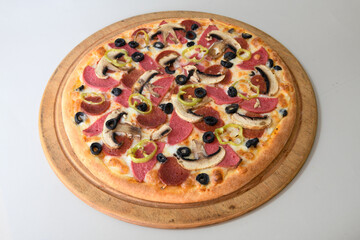 Delicious mixed pizza with rich content. Menu concept of choice and diversity