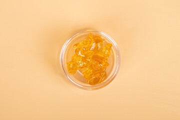 golden cannabis resin concentrate, wax with high thc.