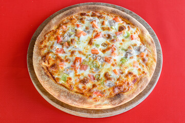 Delicious mixed pizza with rich content. Menu concept of choice and diversity