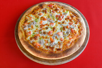Delicious mixed pizza with rich content. Menu concept of choice and diversity