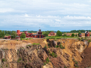 Fototapeta na wymiar Falun Copper Mine the World Heritage with orange mountain visible and tourist spot in background.