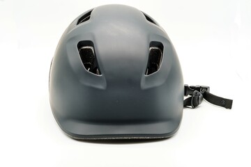 Black cycling helmet with ventilation holes on the head. Safety and protection in sport