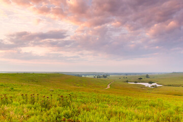 Beautiful Pre-Dawn Summer Photo of the vast Kansas Tallgrass Prairie Preserve. - 521492376