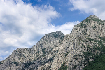 stunning high grey mountain on a sunny day and blue sky, alpine area