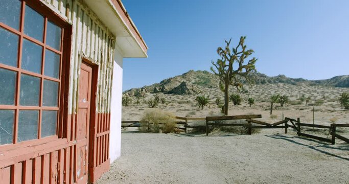 Panning The Side Of An Abandoned Desert Service Station With Split Rail Fence - Lancaster, California
