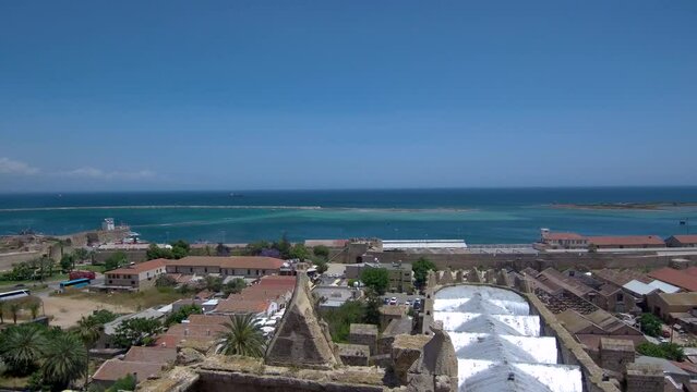 Editorial-Aerial footage of Lala Mustapha Pasha Mosque (formerly a church) in Famagusta city in North Cyprus, view over the roof of the mosque to the sea