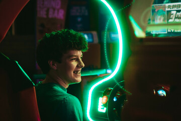 Playing in an arcade with neon lights