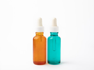 Essential oil in a glass bottle with a pipette. Bottle with fragrant oil isolated on white background. essential oil mockup with copy space. serum.