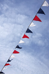 Red blue and white colour bunting flags in summer sky