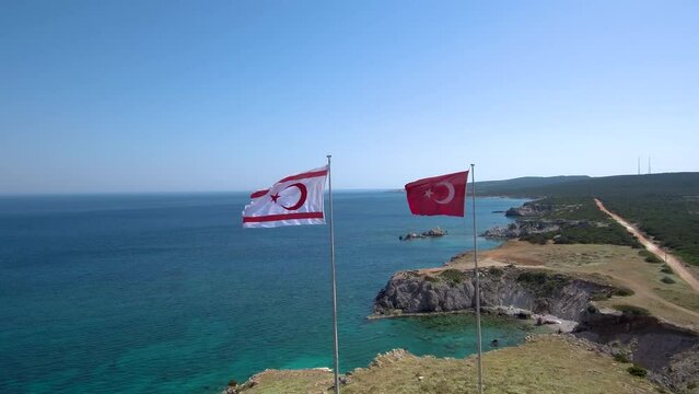 Aerial footage of Cape Victory in Karpass Peninsula of North Cyprus with Turkish Flag and TRNC Flag 