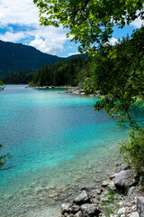 Fototapeta na wymiar Azure coloured lake in the mountains