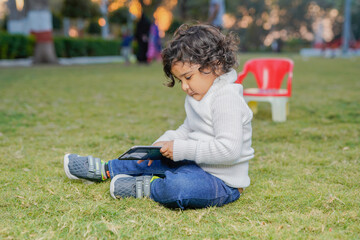Cute indian little child at garden