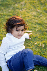 Obraz premium Little boy playing on grass.