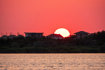 The sun goes down over a lake