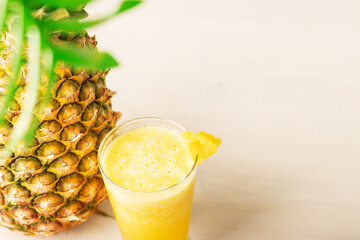 pineapple smoothie, juice in a glass on a white background, fruity summer refreshing cocktail