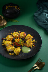 Kesaria Jheenga or Saffron shrimps served in a dish isolated on dark background top view of fastfood